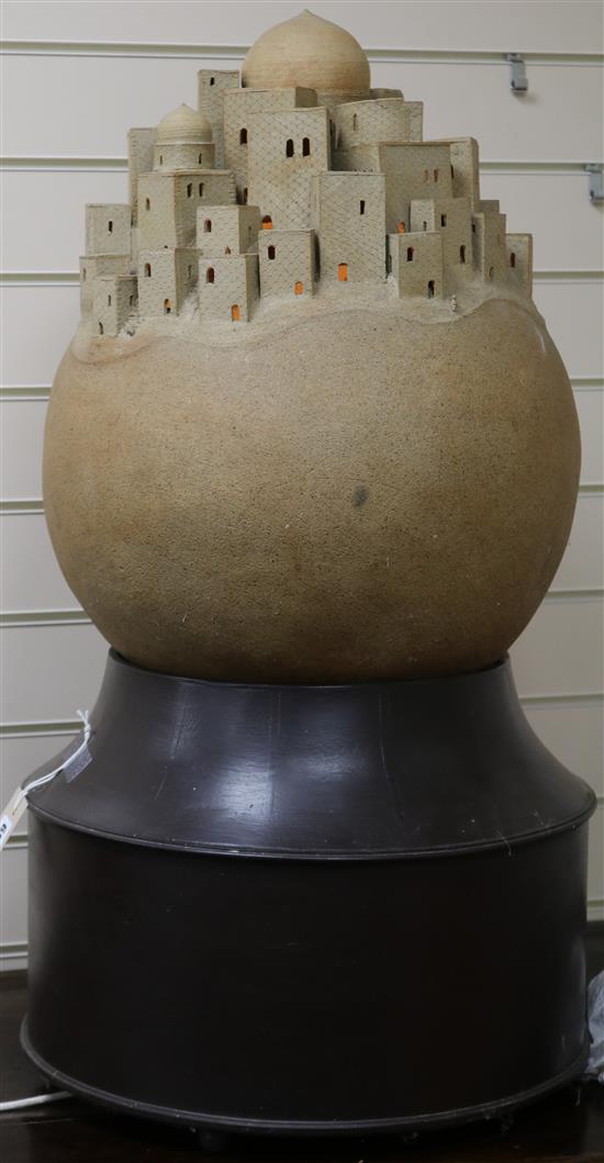A modern stoneware sculpture, Moroccan Village on bespoke stained and polished wood circular stand height 81cm
